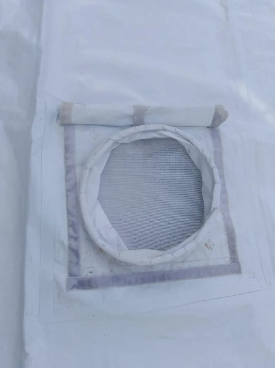 An air-conditioning duct port sewn into a tent sidewall.